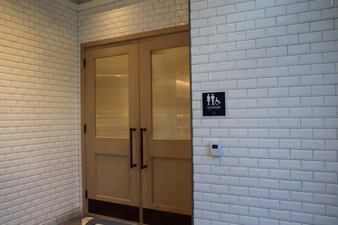 Casa Tua double door with bathroom sign